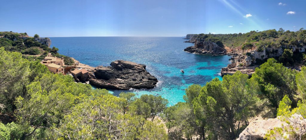 Photo of rugged landscape and shimmering sea in sunny Mallorca